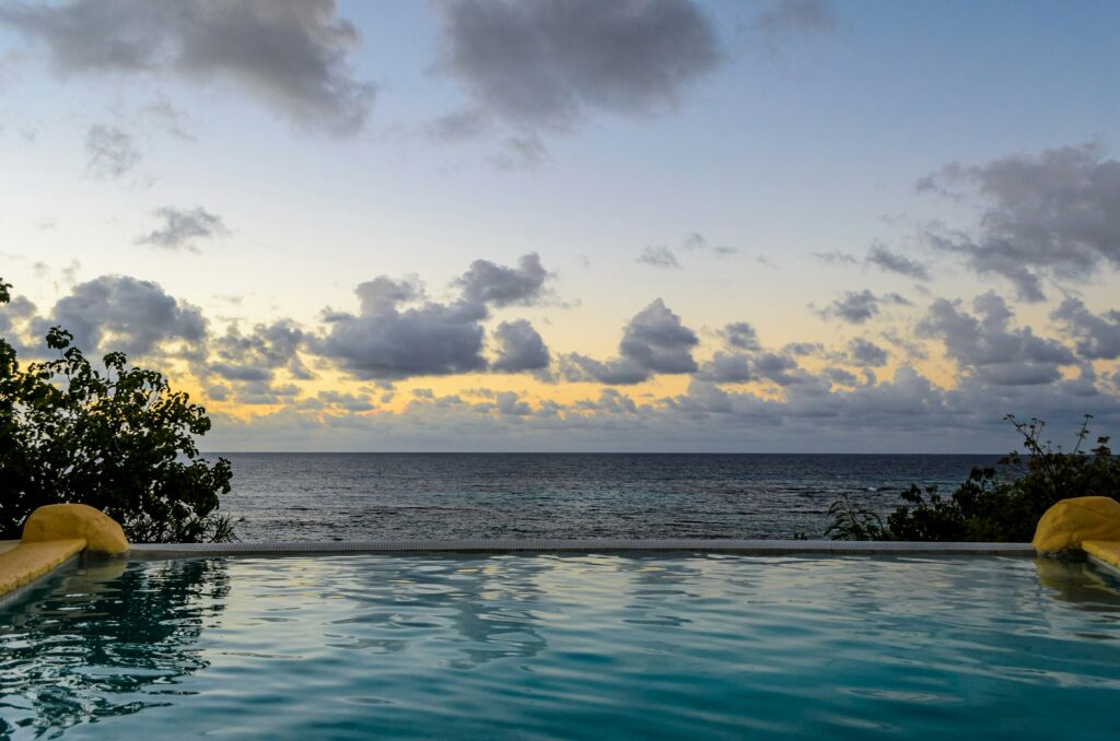 Infinity pool opening onto the Caribbean horizon